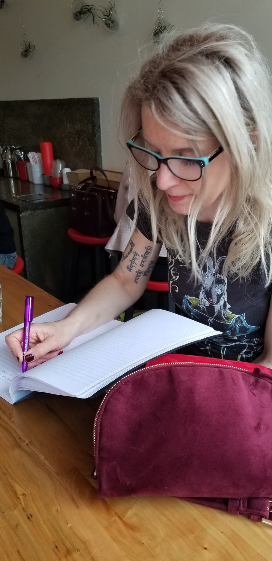 Susan Pickard writing in a notebook